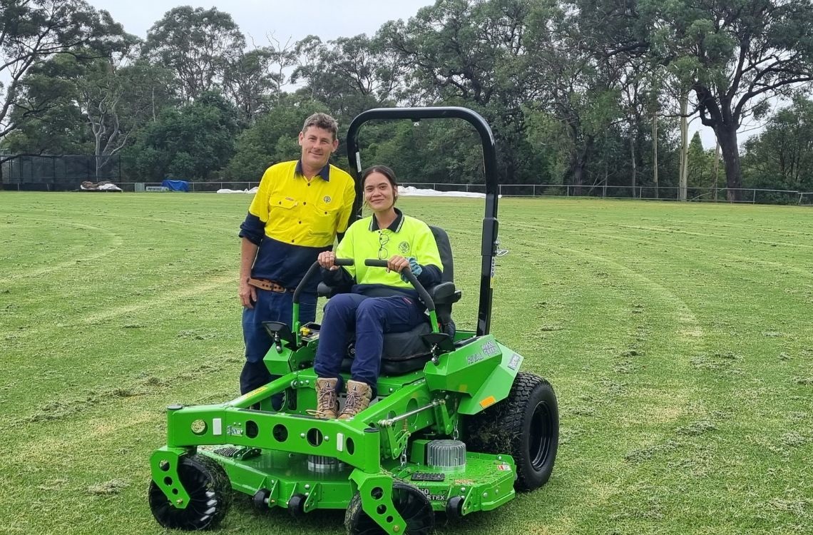 Outside worker pictured trialing new electric mower at Boronia Park Oval