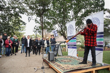 Alfred Coolwell playing the didgeridoo during the Acknowledgement of Country and Smoking Ceremony at Grand Reopening of Figtree Park