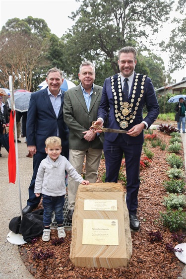 Parliamentary Secretary for Planning and Public Spaces, Stephen Bali, Lane Cove State MP Anthony Roberts, his son and Mayor of Hunter’s Hill Council, Zac Miles, pictured near new plaque at Figtree Park