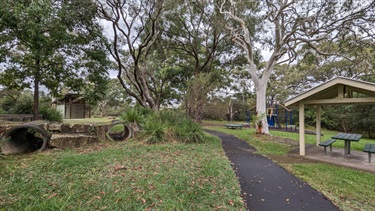 Boronia Park North showing closer shot of the sheltered gazebo, plus shows the toilets block in the background as well as a few concrete tunnels as well as a closer shot of the secondary playground equipment