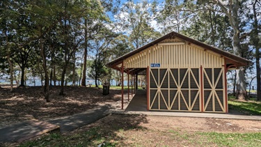 Photo shows the toilet block at Clarkes Point. Including the public waste bin for park goers to use.