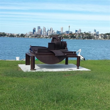‘Chardin’s Table’ by David Horton, was exhibited at the 2012 Sculptures by the Sea.  The piece has a strong industrial flavour and marries well with the notion of the working Harbour and the former use of Cockatoo Island.  Chardin’s Table was donated to Council by Mr Ron Kaplan and can be viewed in Clarkes Point Reserve.